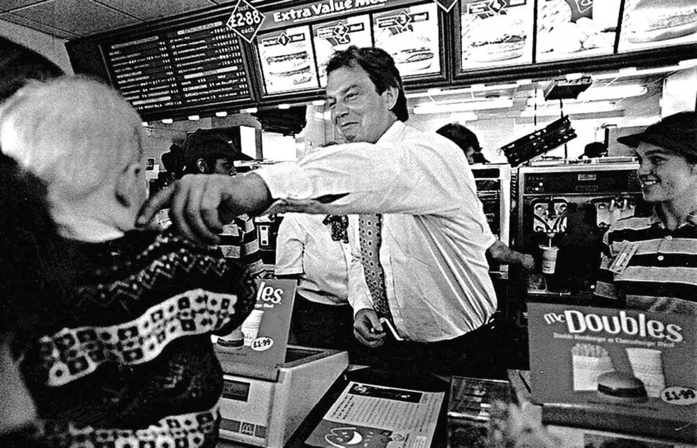 Tony Blair wooing children from behind a McDonald’s burger bar in Coventry, 1996.